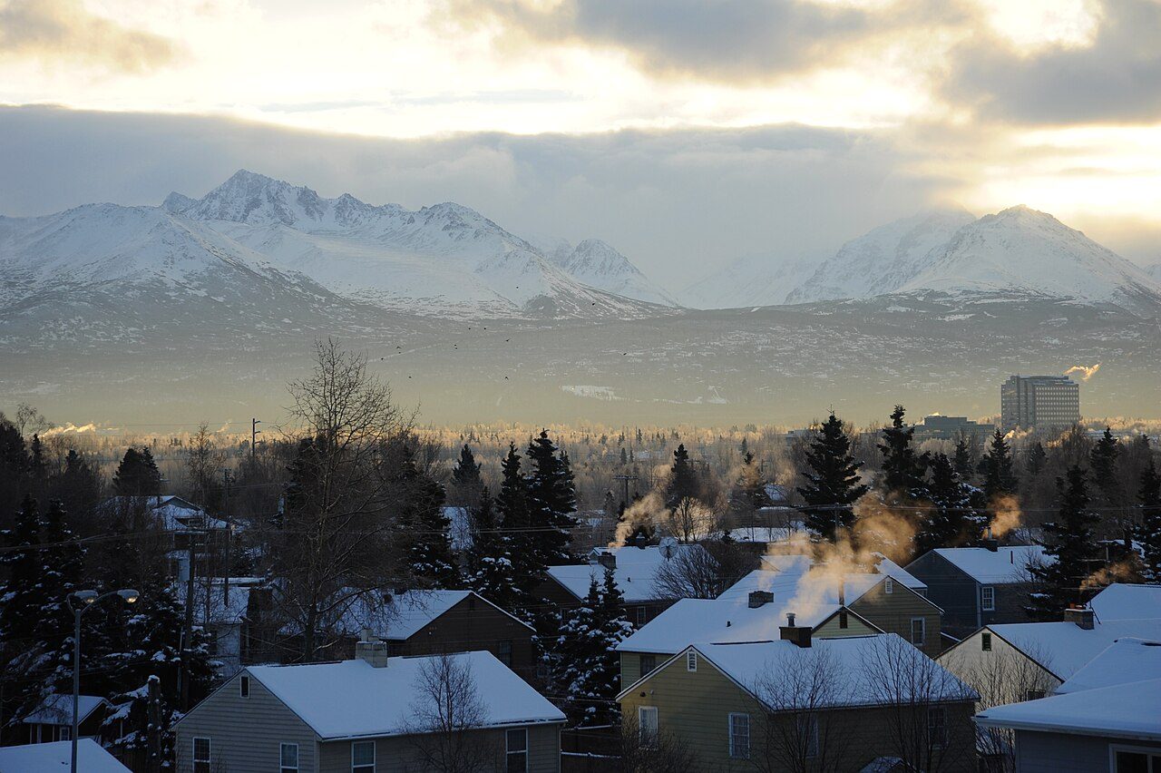 Snow-covered Chugach foothills above Anchorage houses in winter