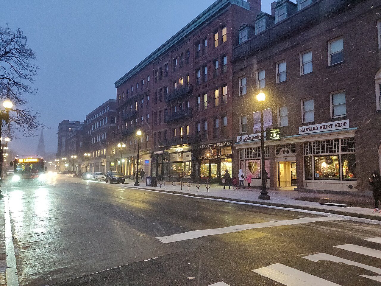 Harvard Square in Cambridge on a winter day, with the subway kiosk and surrounding shops