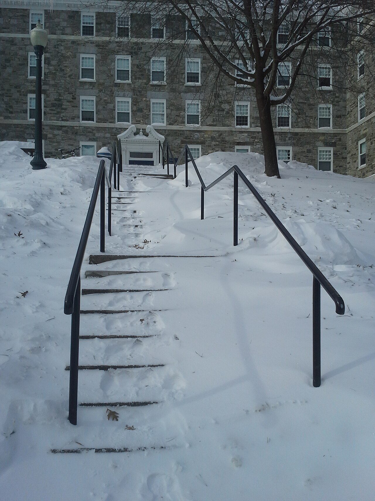 Snow-covered steps leading to Gifford Hall at Middlebury College
