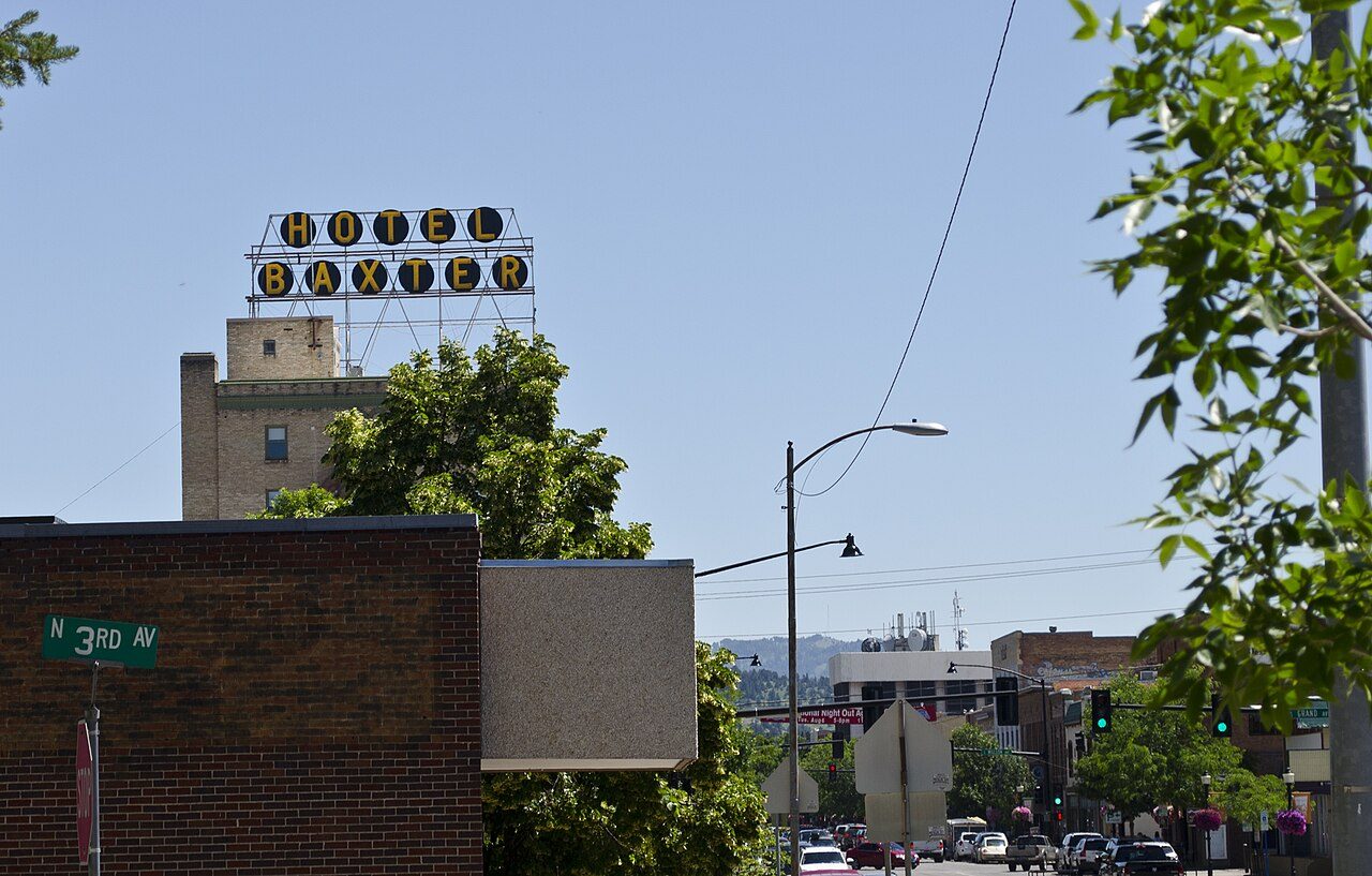 Main Street in downtown Bozeman with the Hotel Baxter sign