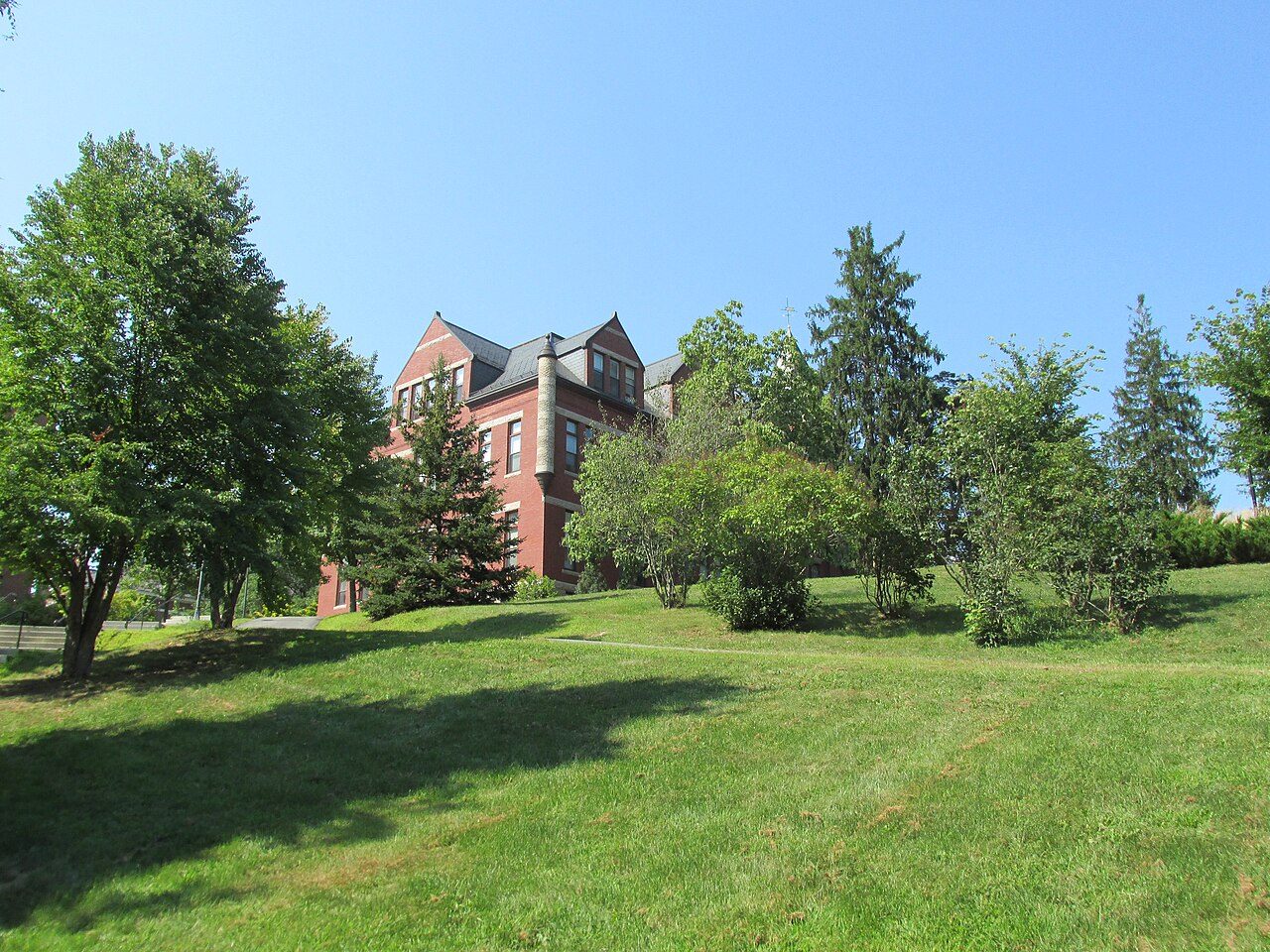 The grassy slope and paths behind Thompson Hall at UNH